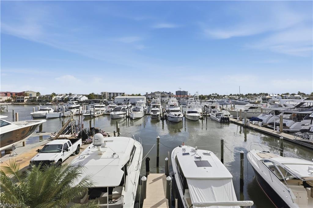 909 10th Street South, Unit 201 Naples, FL 34102 - Photo 18 of 42 Dock area featuring a water view