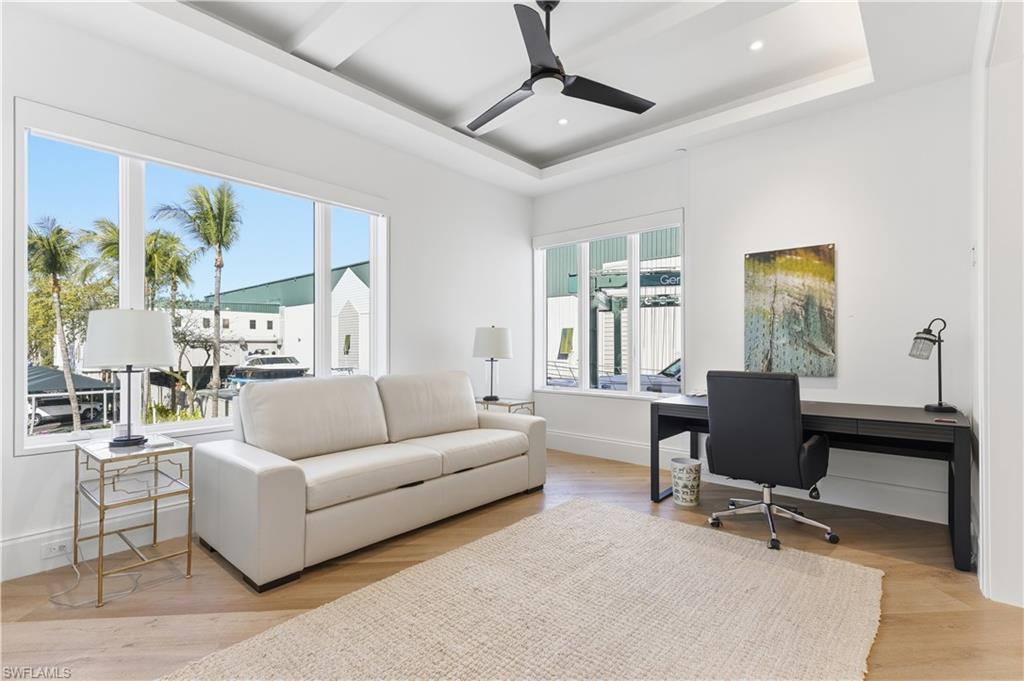 909 10th Street South, Unit 201 Naples, FL 34102 - Photo 23 of 42 Office space featuring light wood-type flooring, ceiling fan, a raised ceiling, and recessed lighting