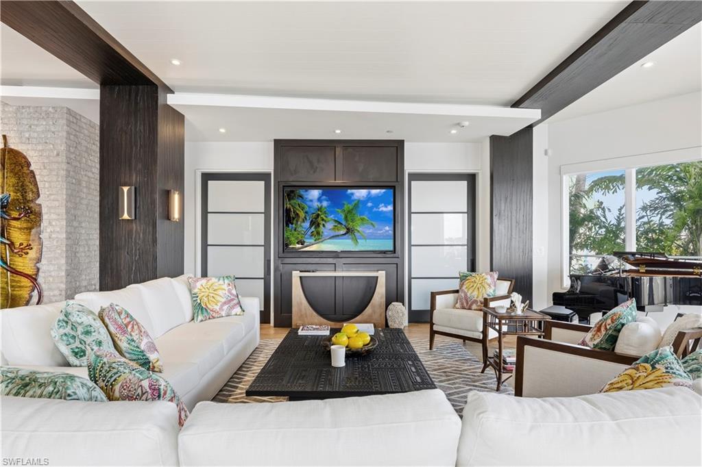 909 10th Street South, Unit 201 Naples, FL 34102 - Photo 29 of 42 Living room with light wood-style flooring and recessed lighting