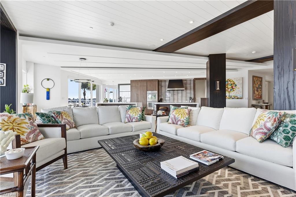 909 10th Street South, Unit 201 Naples, FL 34102 - Photo 3 of 42 Living area featuring beamed ceiling and recessed lighting