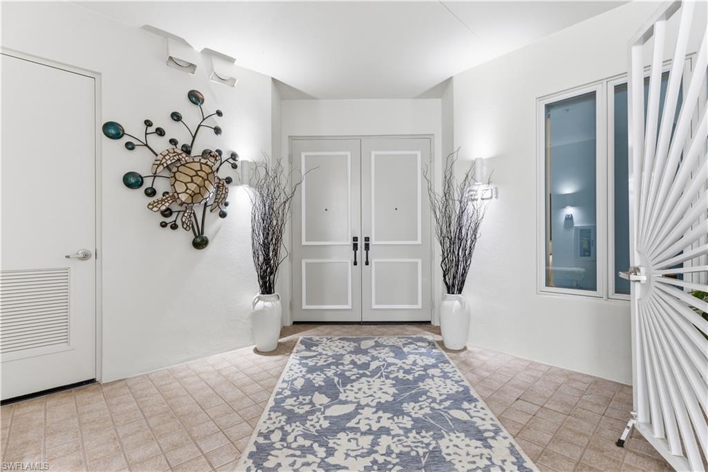 909 10th Street South, Unit 201 Naples, FL 34102 - Photo 32 of 42 View of entrance foyer