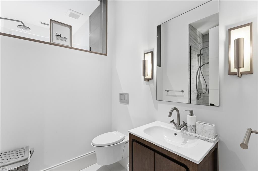 909 10th Street South, Unit 201 Naples, FL 34102 - Photo 36 of 42 Full bath featuring vanity and a shower