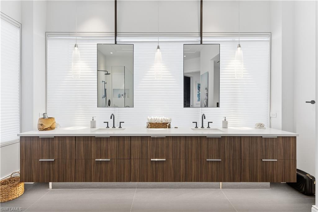 909 10th Street South, Unit 201 Naples, FL 34102 - Photo 10 of 42 Full bath with double vanity, a shower, and light tile patterned floors