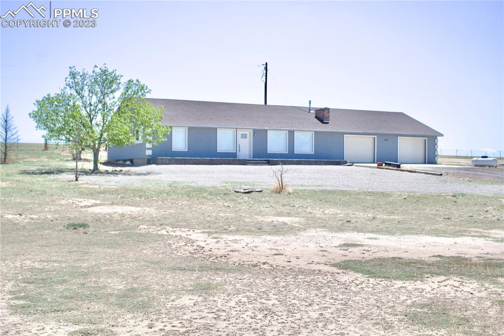 425 Weissenfluh Road Yoder, CO 80864 - Photo 1 of 38 a view of a house with a yard