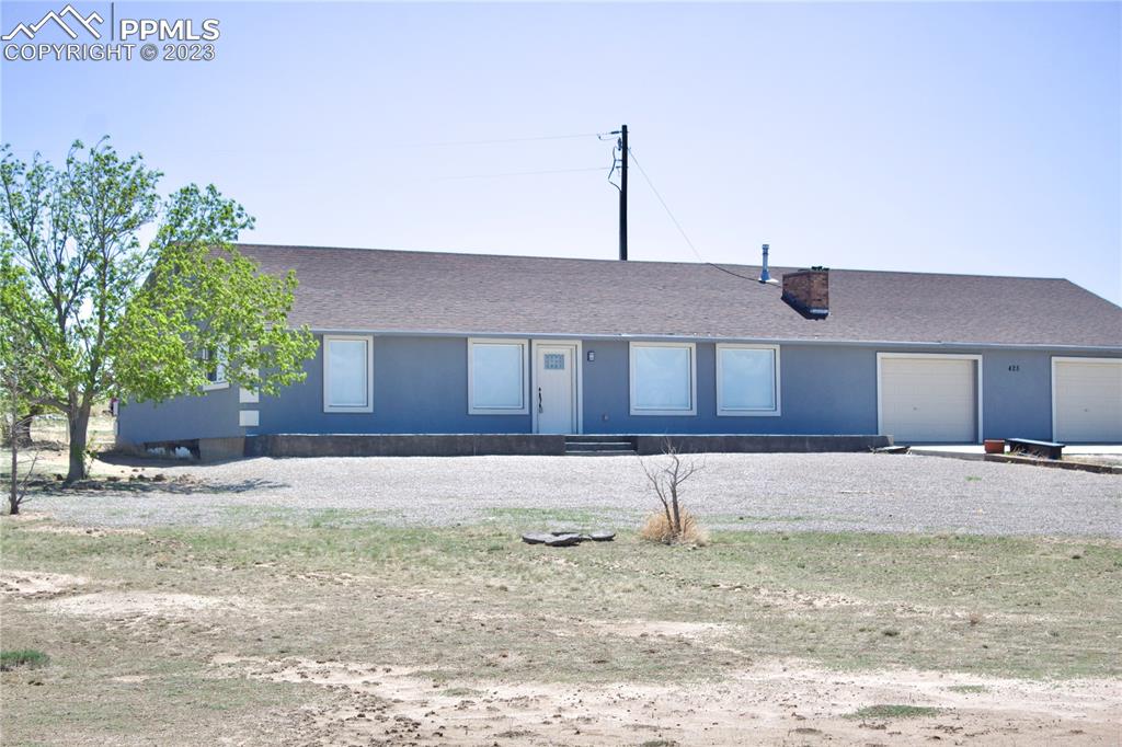 425 Weissenfluh Road Yoder, CO 80864 - Photo 2 of 38 a house that has a tree in the background