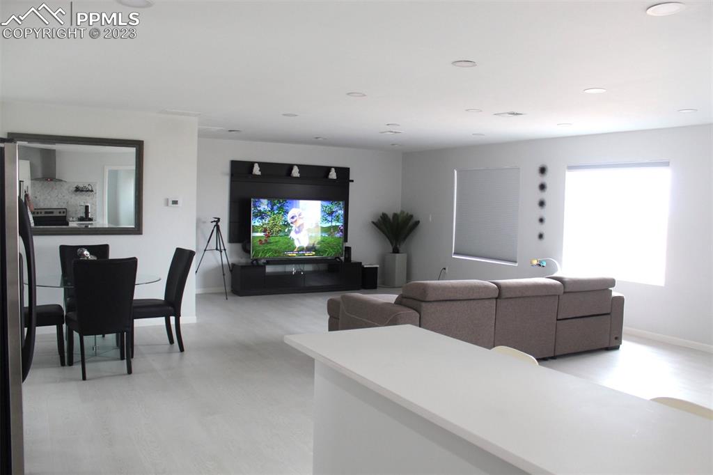 425 Weissenfluh Road Yoder, CO 80864 - Photo 23 of 38 a living room with furniture and a flat screen tv