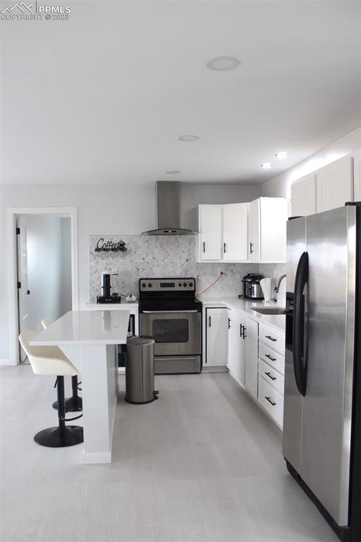 425 Weissenfluh Road Yoder, CO 80864 - Photo 26 of 38 a kitchen with a sink stainless steel appliances and white cabinets