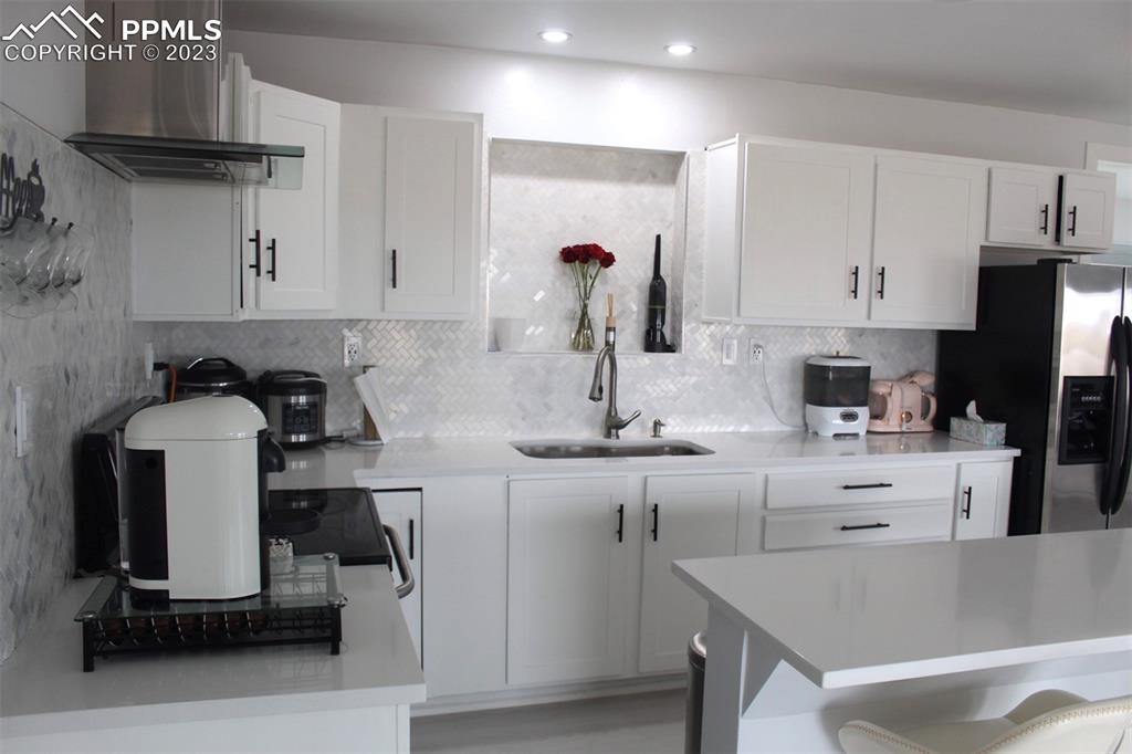 425 Weissenfluh Road Yoder, CO 80864 - Photo 29 of 38 a kitchen with a sink cabinets and window
