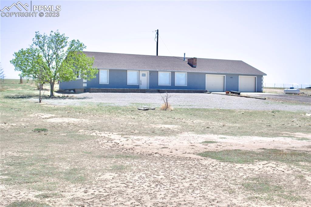 425 Weissenfluh Road Yoder, CO 80864 - Photo 3 of 38 a front view of a house with a yard