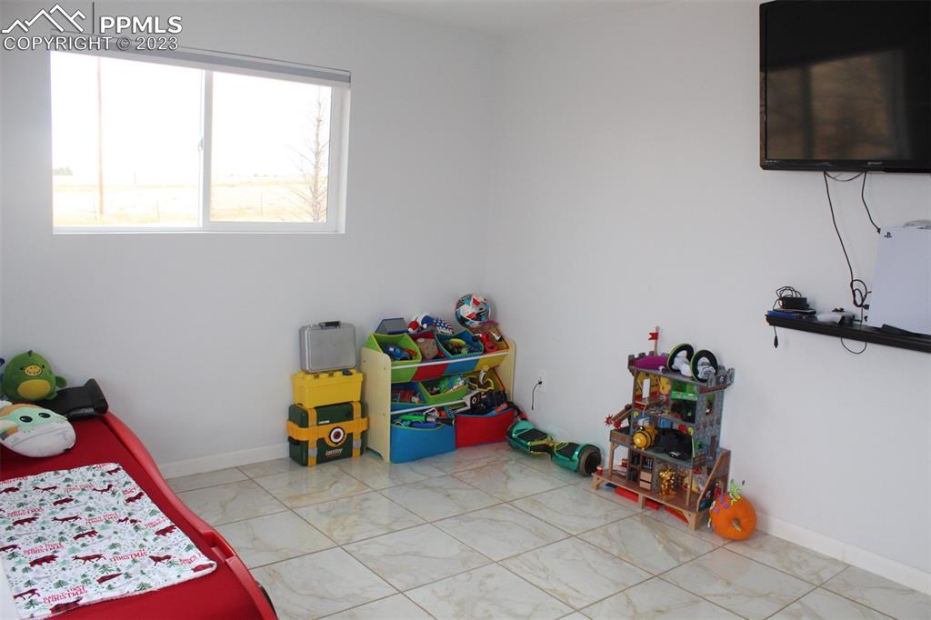 425 Weissenfluh Road Yoder, CO 80864 - Photo 35 of 38 a room with toys and a window