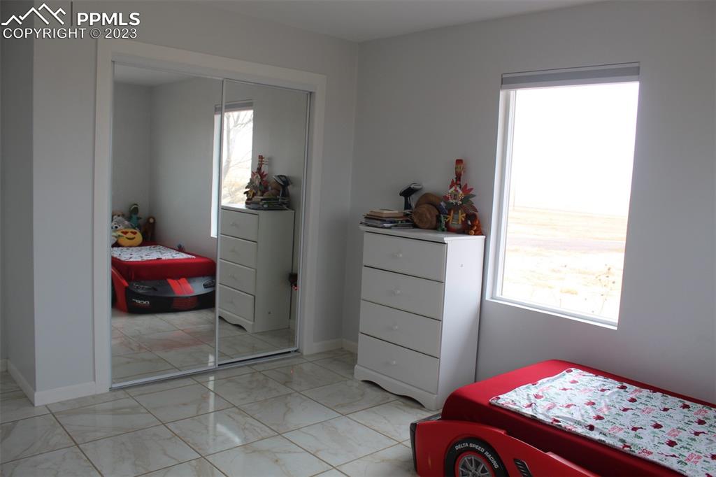 425 Weissenfluh Road Yoder, CO 80864 - Photo 36 of 38 a bedroom with a bed and a window