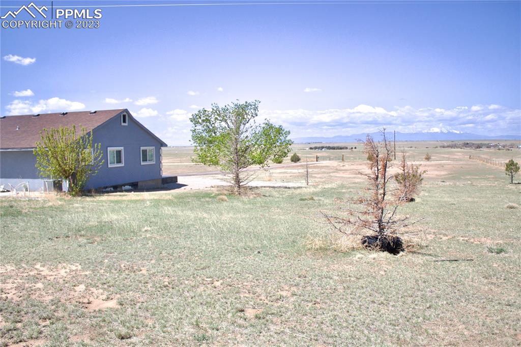 425 Weissenfluh Road Yoder, CO 80864 - Photo 5 of 38 a view of a house with a yard