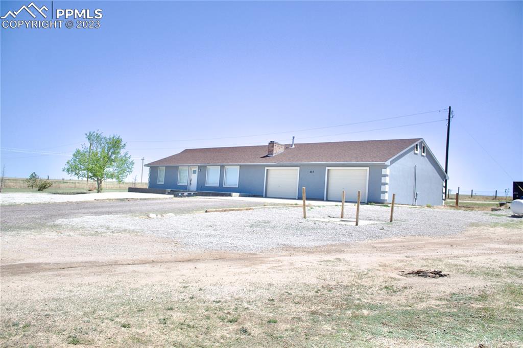 425 Weissenfluh Road Yoder, CO 80864 - Photo 6 of 38 a view of a house with a yard
