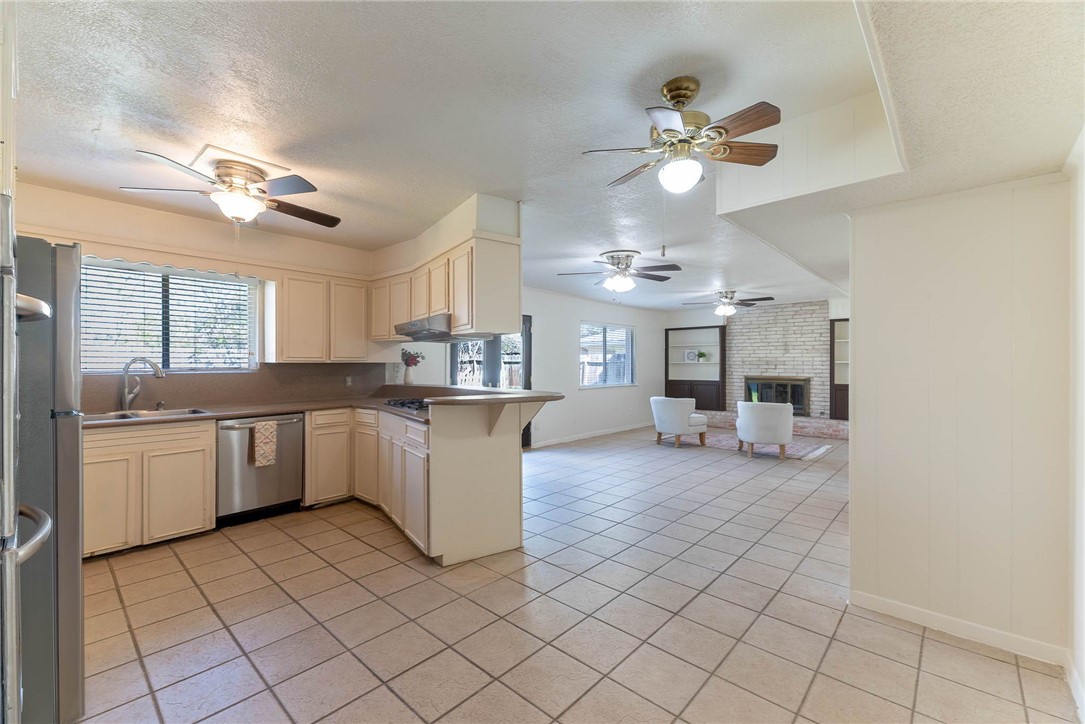 4622 Coventry Lane Corpus Christi, TX 78411 - Photo 13 of 31 a kitchen with a stove a sink and cabinets