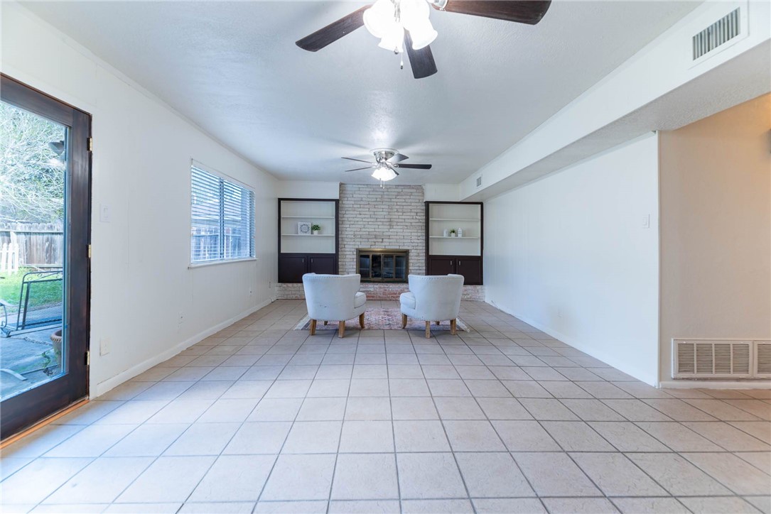 4622 Coventry Lane Corpus Christi, TX 78411 - Photo 19 of 31 a living room with furniture and a chandelier