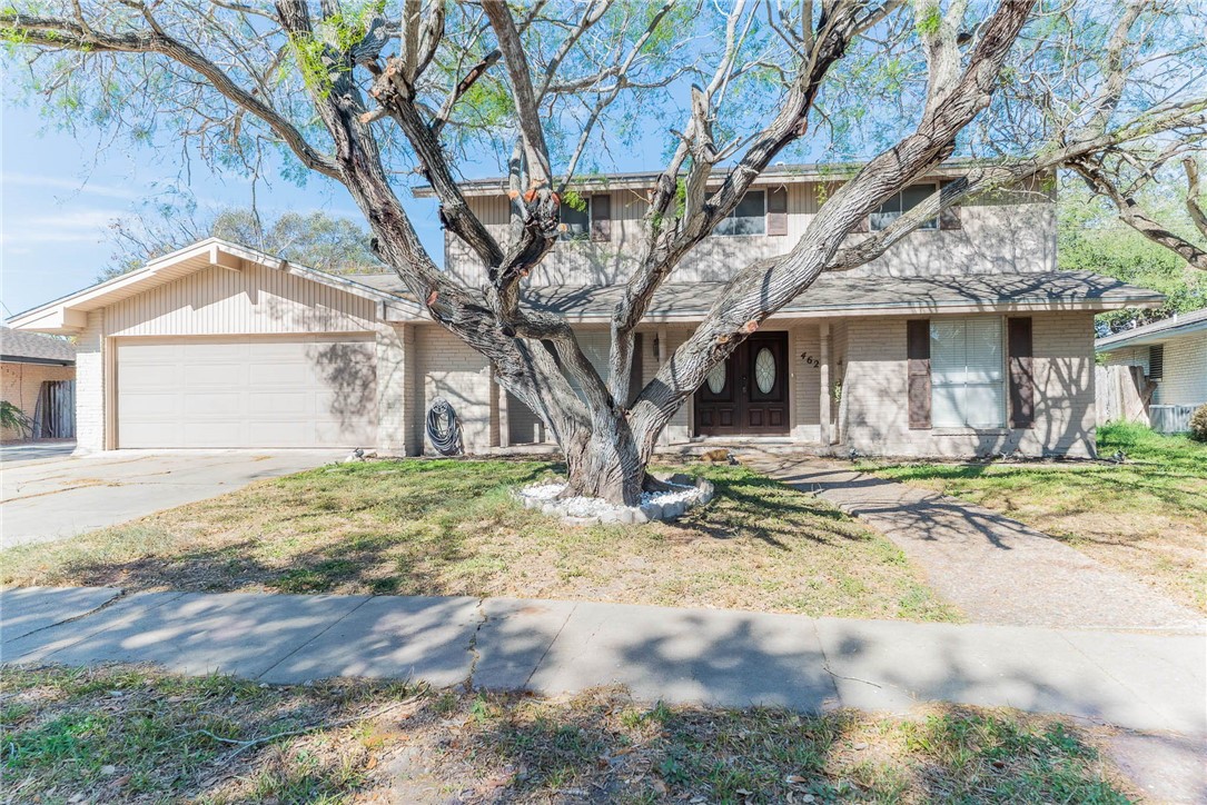 4622 Coventry Lane Corpus Christi, TX 78411 - Photo 2 of 31 a view of a white house with a large tree