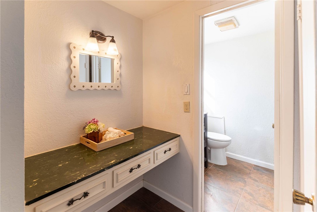 4622 Coventry Lane Corpus Christi, TX 78411 - Photo 26 of 31 a bathroom with a toilet sink and mirror