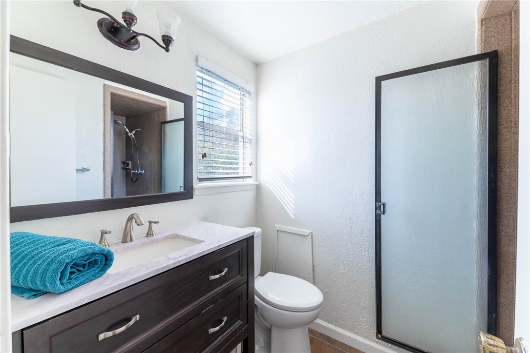 4622 Coventry Lane Corpus Christi, TX 78411 - Photo 27 of 31 a bathroom with a sink and a mirror