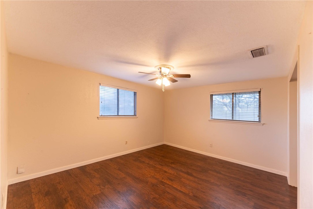 4622 Coventry Lane Corpus Christi, TX 78411 - Photo 28 of 31 a view of a big room with wooden floor and windows