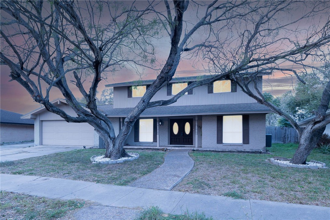 4622 Coventry Lane Corpus Christi, TX 78411 - Photo 5 of 31 a front view of a house with yard and trees
