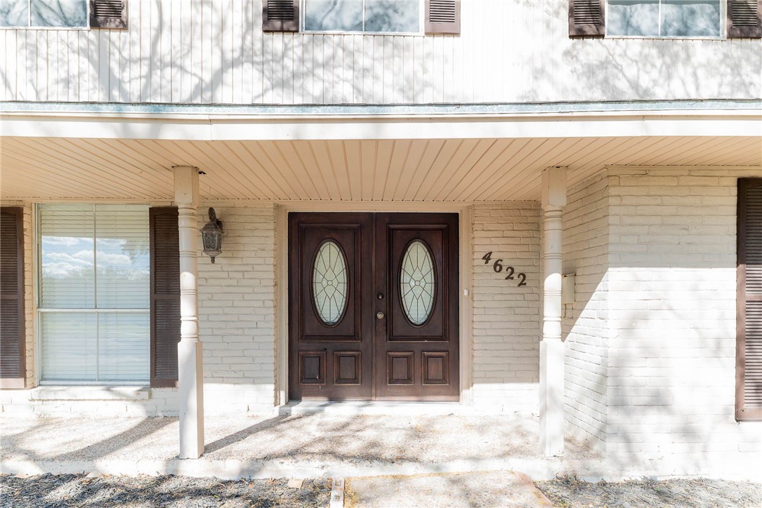 4622 Coventry Lane Corpus Christi, TX 78411 - Photo 6 of 31 a front view of a house with glass windows