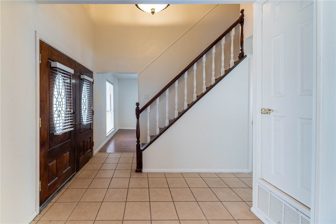 4622 Coventry Lane Corpus Christi, TX 78411 - Photo 7 of 31 a view of an entryway with wooden floor and windows