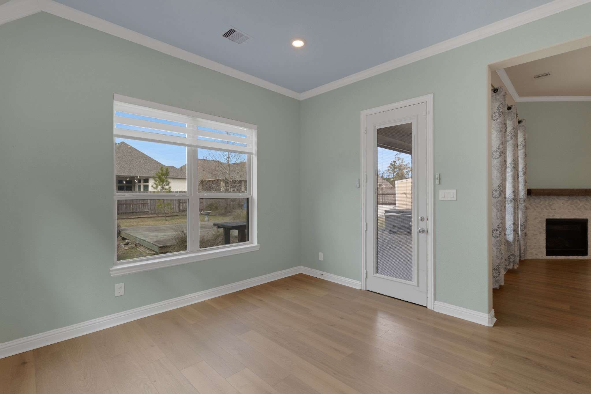 23509 Red Juniper Lane New Caney, TX 77357 - Photo 14 of 48 a view of an empty room with wooden floor and a window