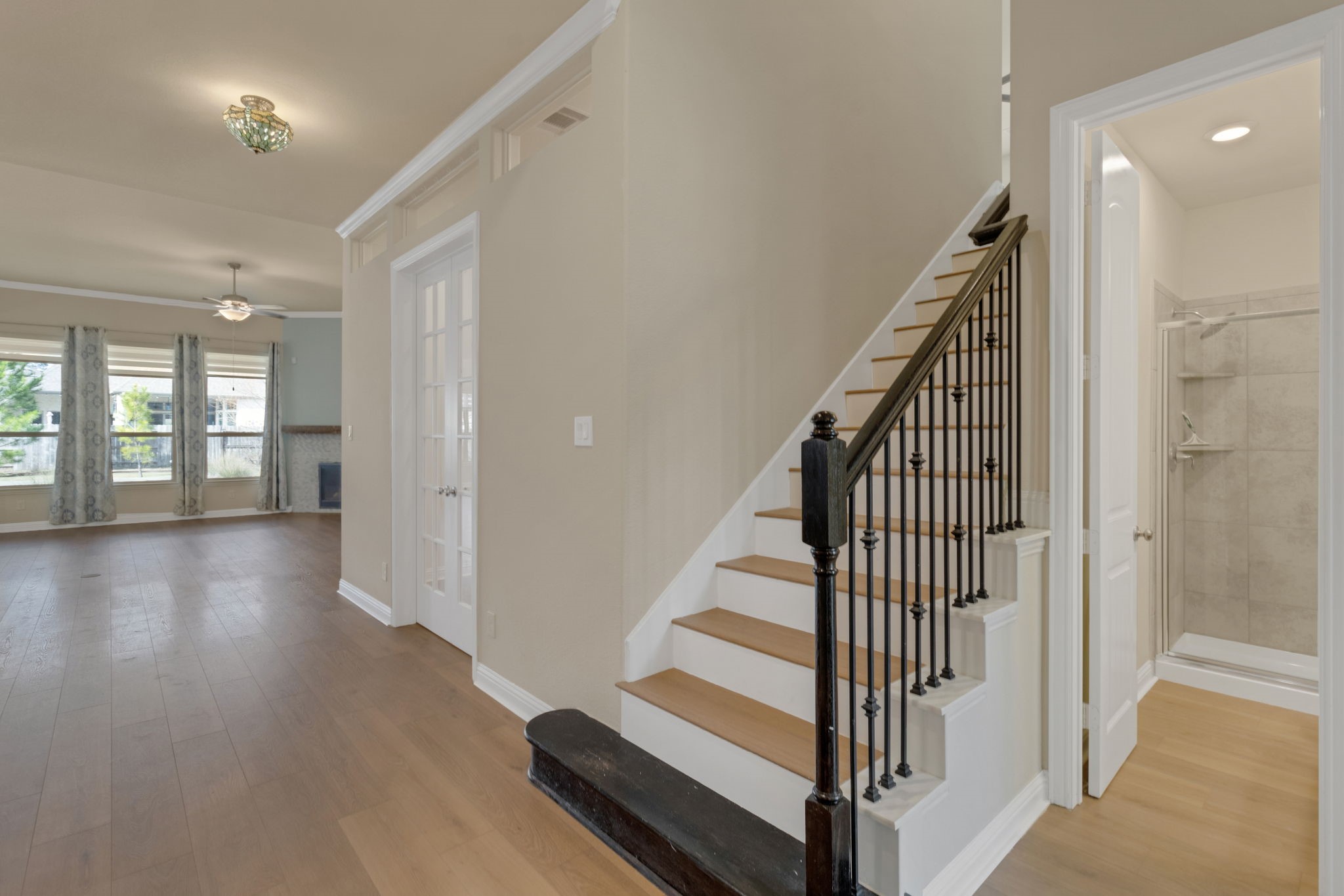 23509 Red Juniper Lane New Caney, TX 77357 - Photo 4 of 48 a view of a hallway with wooden floor and staircase