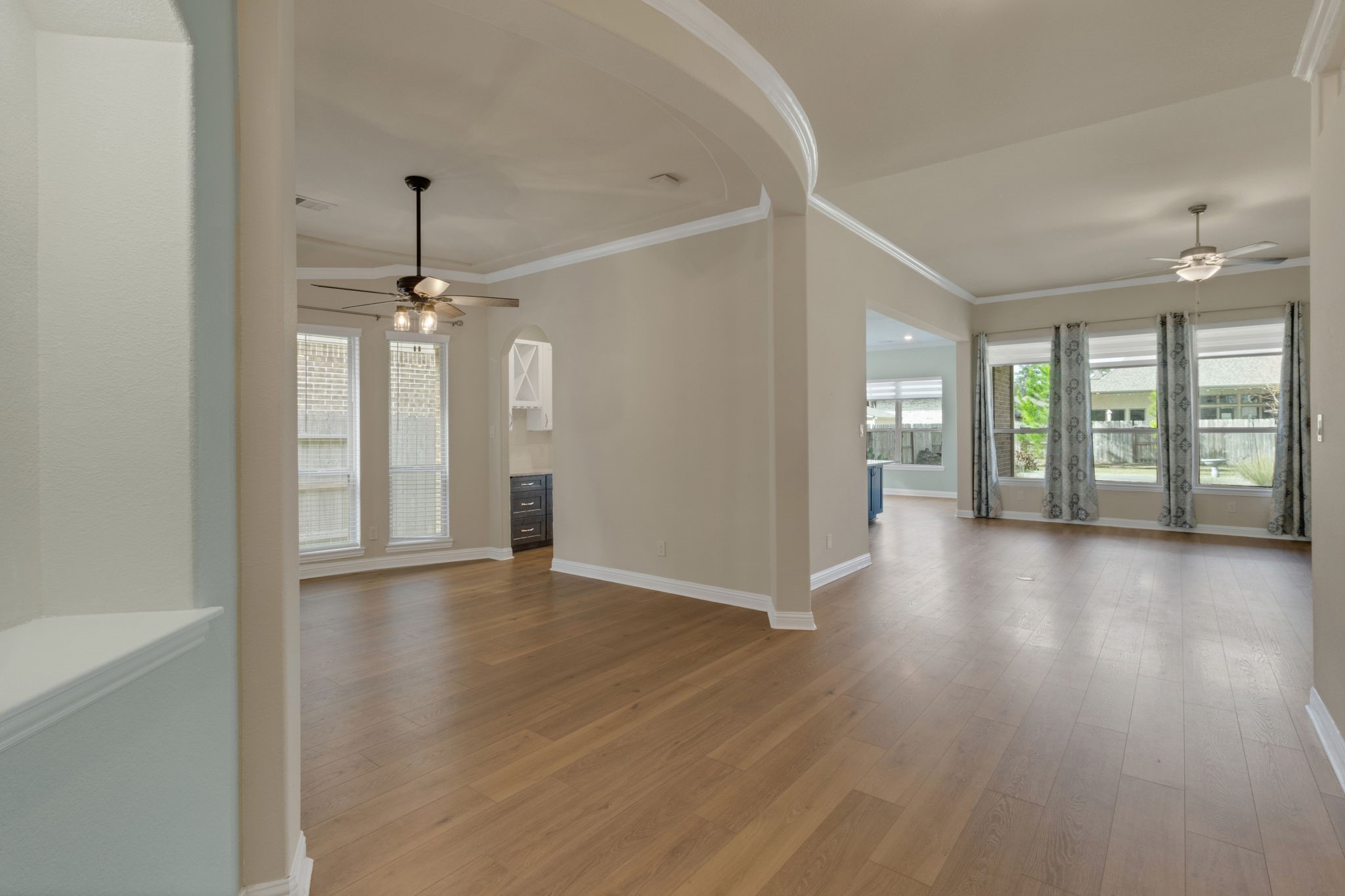 23509 Red Juniper Lane New Caney, TX 77357 - Photo 5 of 48 a view of an empty room with window and wooden floor