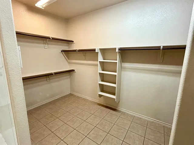 a view of an empty walk in closet