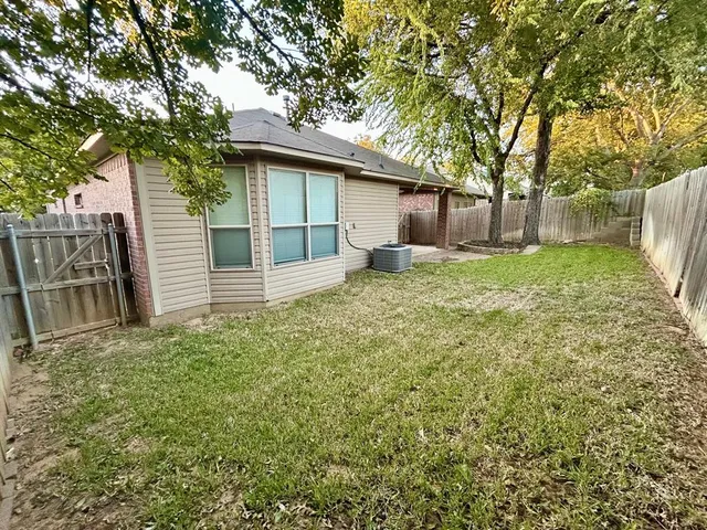 a house with a tree in front of it