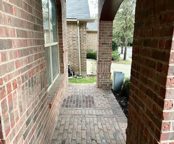 a view of a pathway both side of house