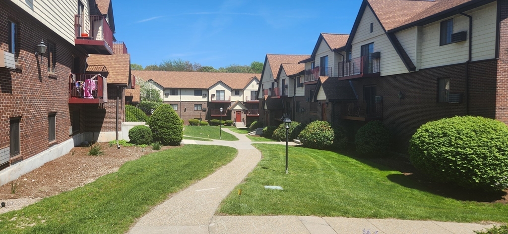 1003 North Main Street, Unit 7 Randolph, MA 02368 - Photo 27 of 31 a front view of a house with a yard