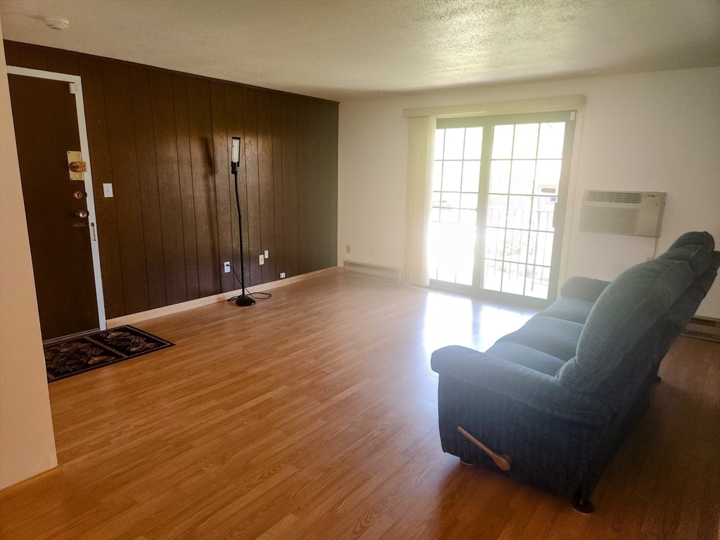 1003 North Main Street, Unit 7 Randolph, MA 02368 - Photo 7 of 31 a view of livingroom with furniture and windows