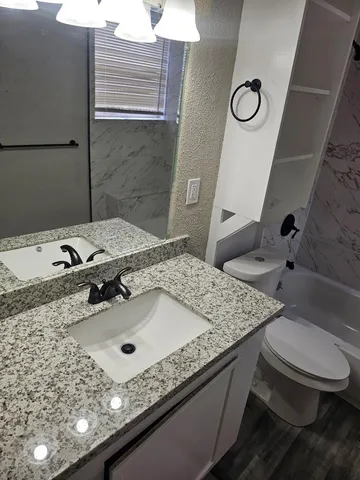 a bathroom with a sink and mirror