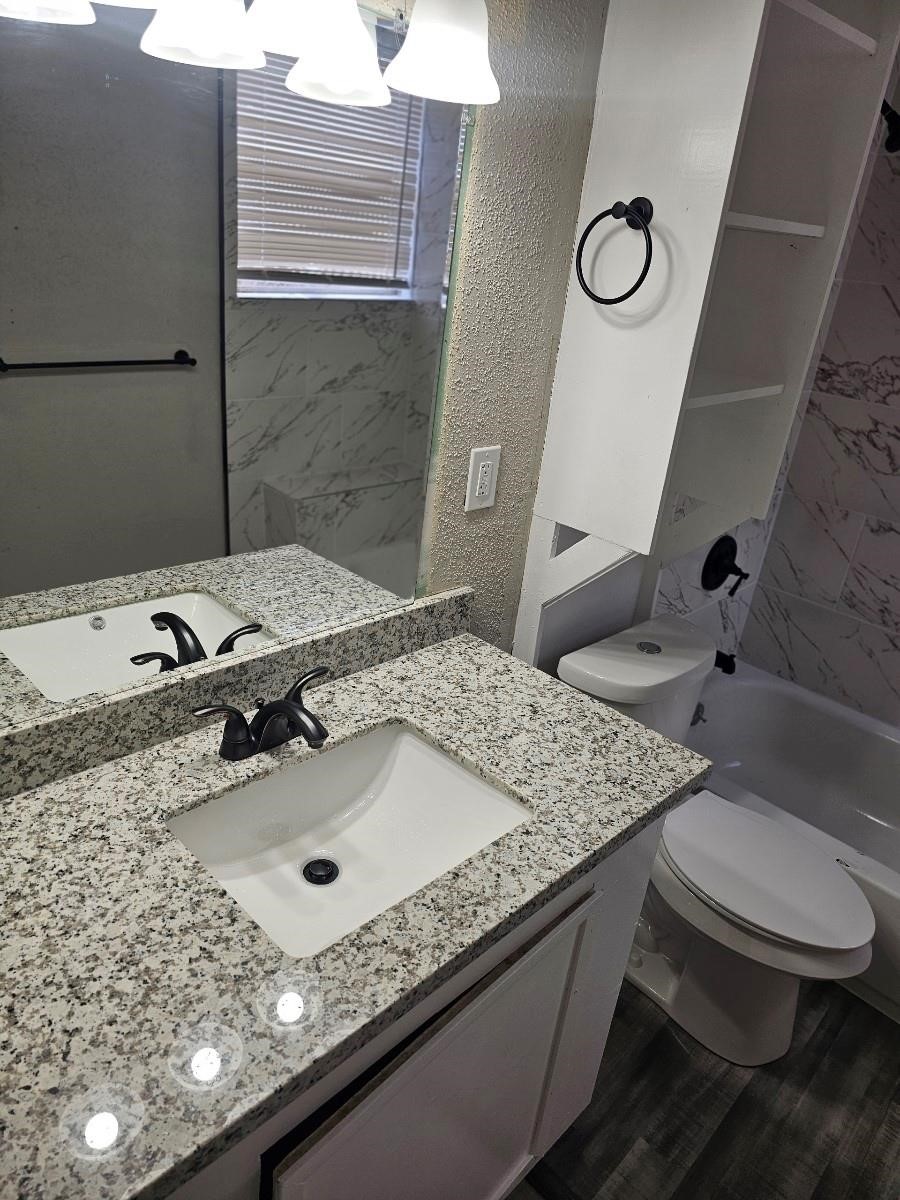 8010 Miley Street Houston, TX 77028 - Photo 4 of 8 a bathroom with a sink and mirror