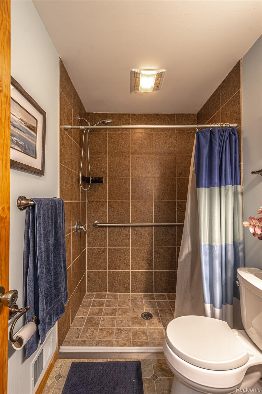 3241 Simpson Road Fort Gratiot, MI 48059 - Photo 20 of 27 Tiled shower with grab bar and handheld showerhead