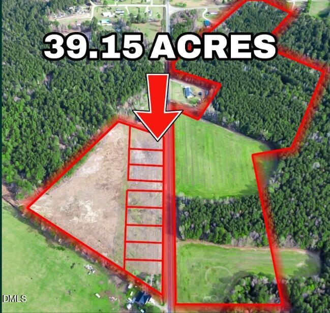 378 Rozier Church Road Lumberton, NC 28360 - Photo 1 of 10 a street sign that is on a big yard with potted plants