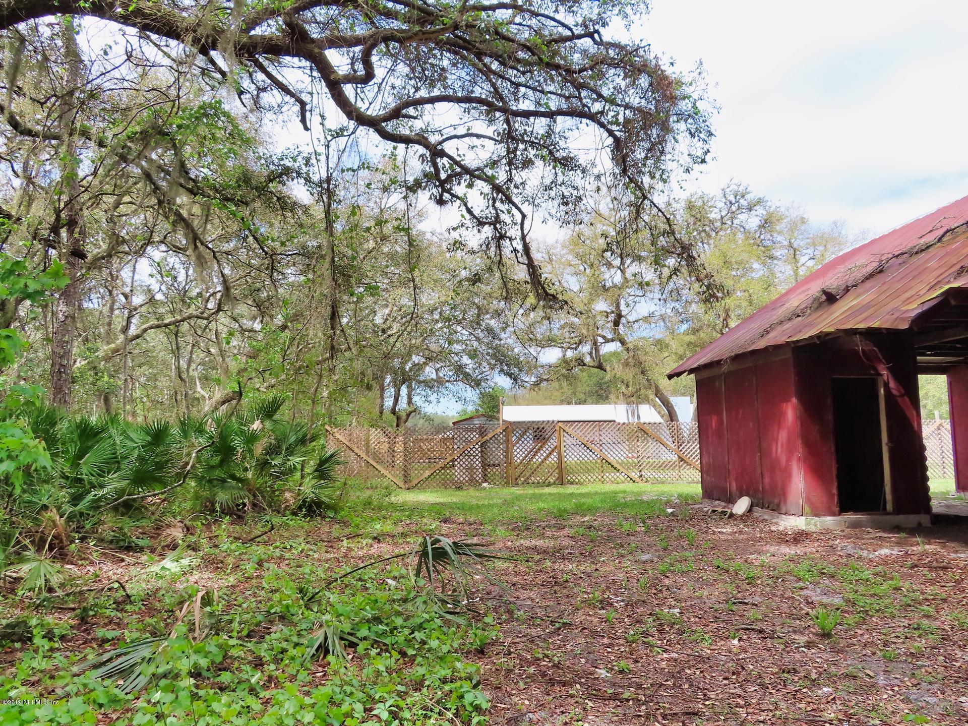 128 Hoover Road Palatka, FL 32177 - Photo 14 of 55 Space around the barn...