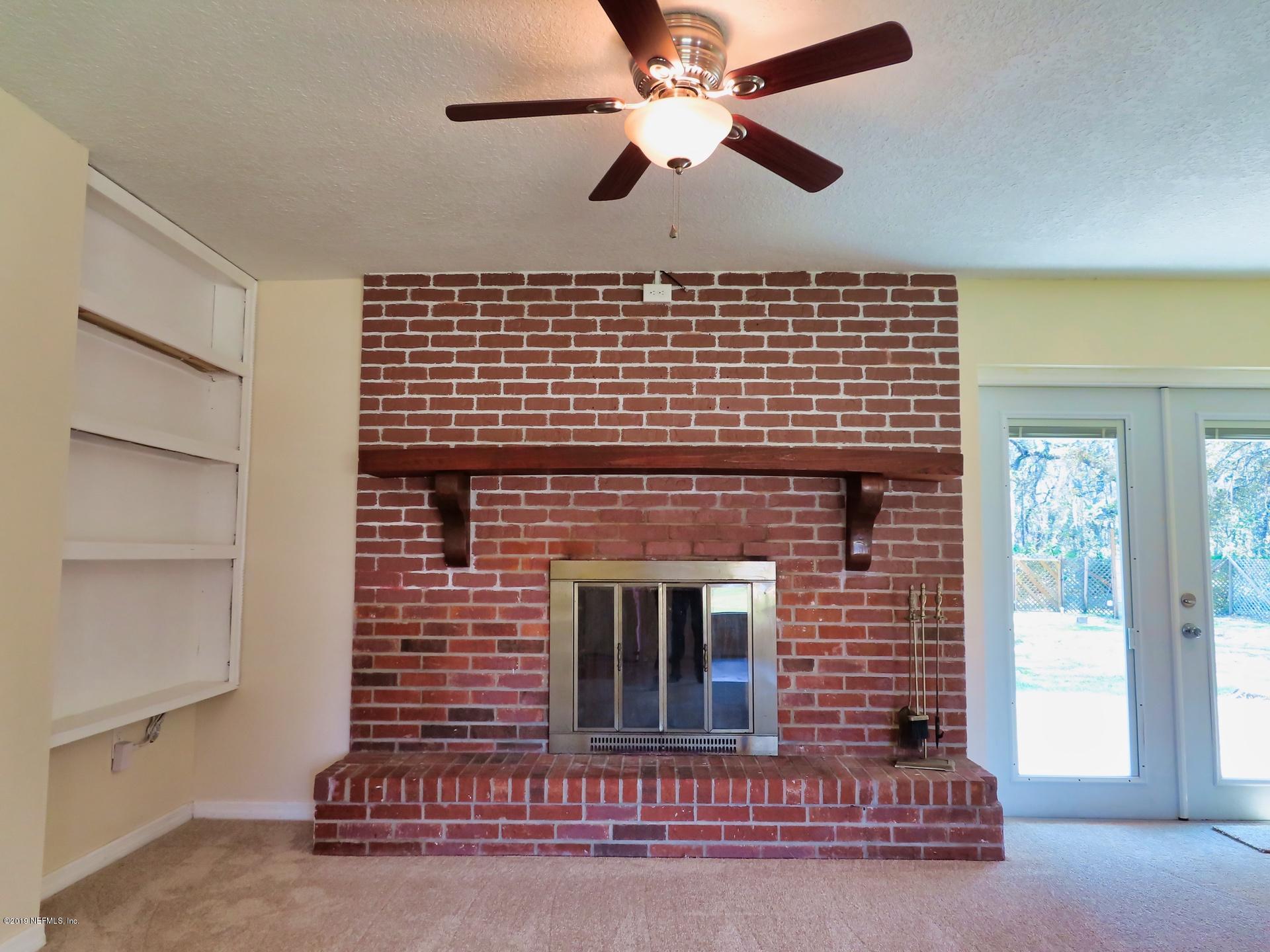 128 Hoover Road Palatka, FL 32177 - Photo 19 of 55 Natural brick, wood-burning fireplace...