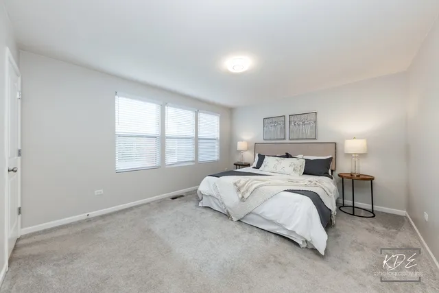 a bedroom with bed and a window