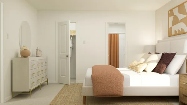 a bedroom with a bed and a cabinets