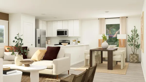 a living room with furniture a flat screen tv and a potted plant