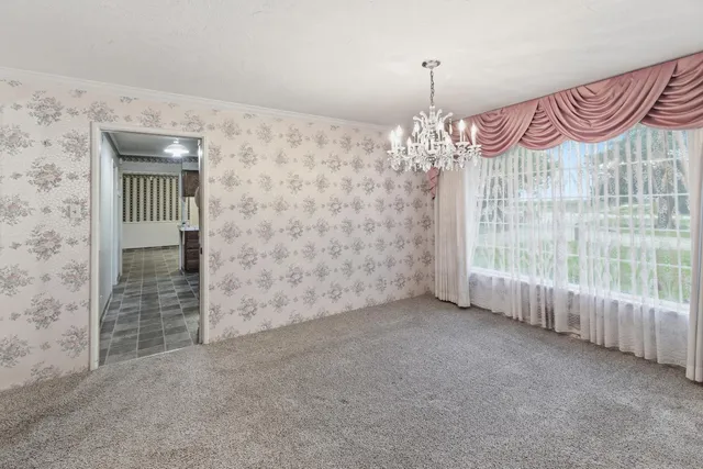 a kitchen with a refrigerator a sink and cabinets