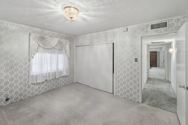 an empty room with a bathroom