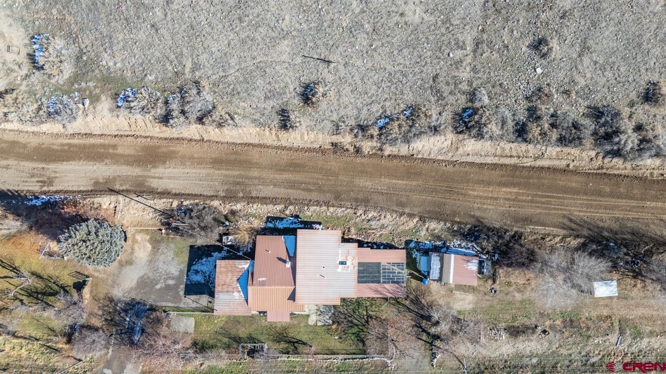 16322 Chipeta Road Montrose, CO 81403 - Photo 41 of 42 a view of a lake with a yard