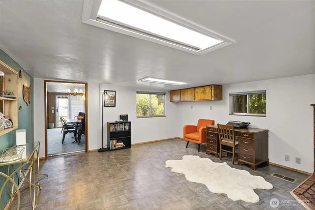 a bedroom with furniture and a window