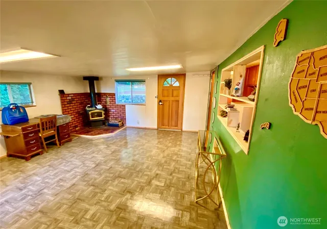 an empty room with furniture and windows