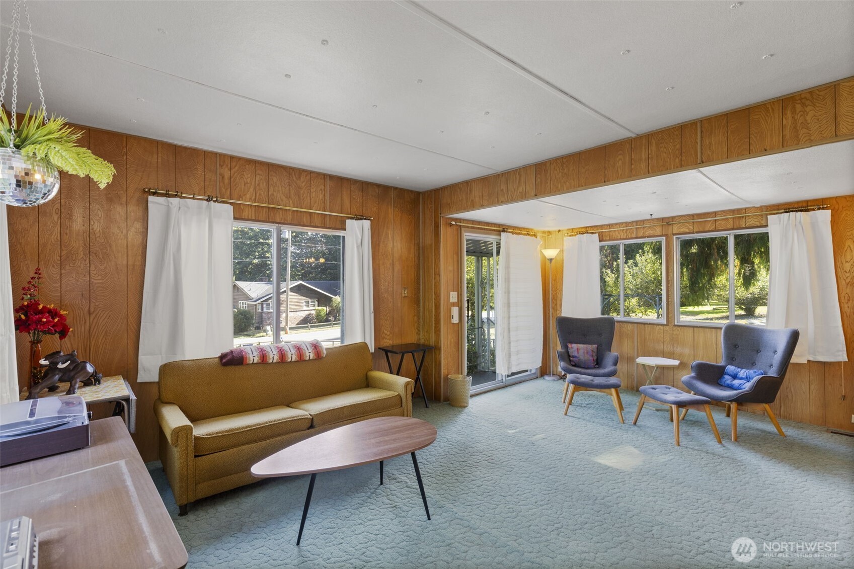 8491 Illahee Road Northeast Bremerton, WA 98311 - Photo 22 of 36 a living room with furniture and a large window