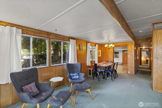 a view of a dining room with furniture and window